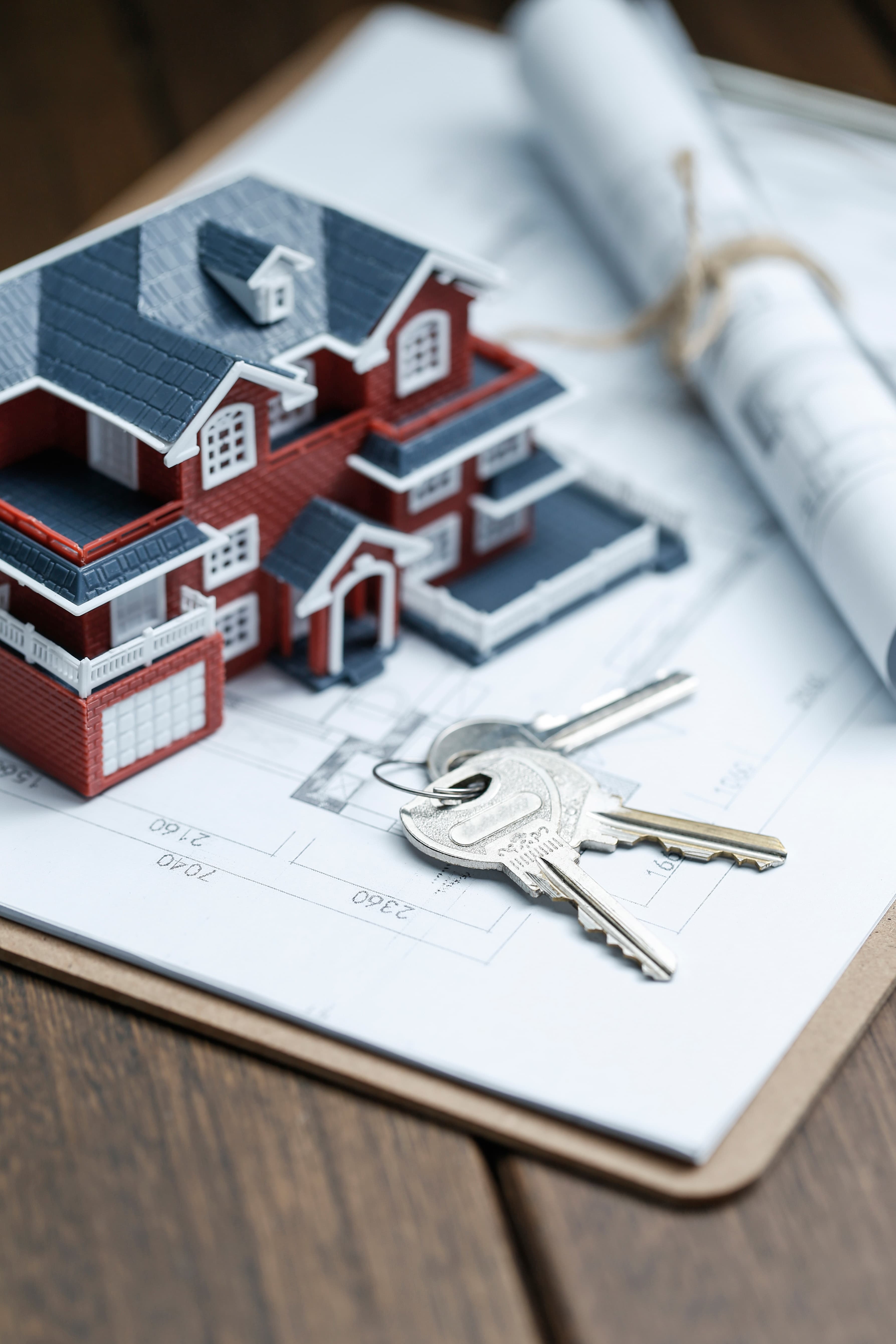 Real estate model, key, and property plans